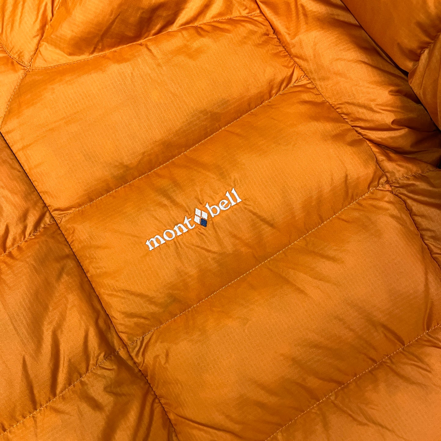 Montbell orange puffer (S)