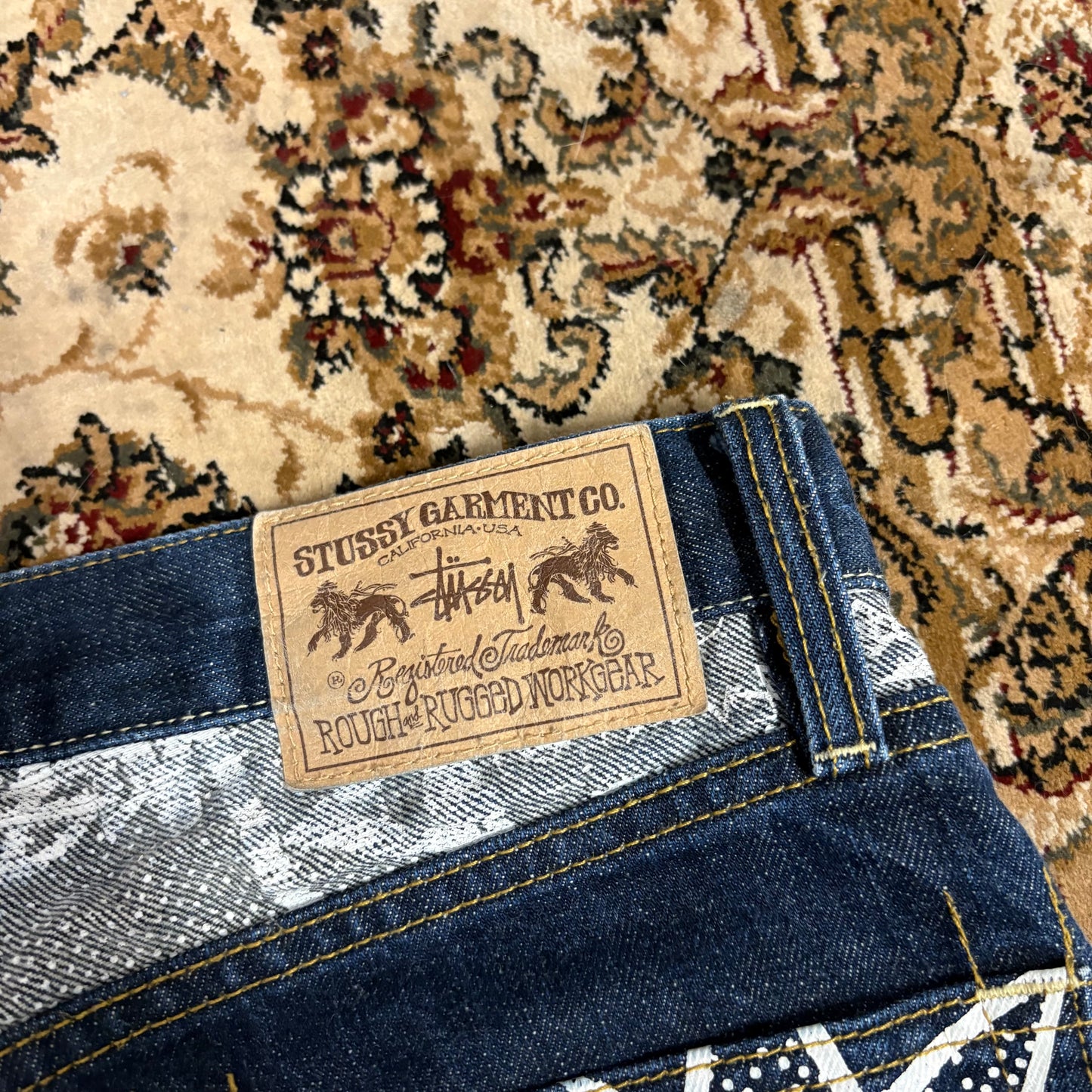 Stussy navy blue graphic jeans (W30”)