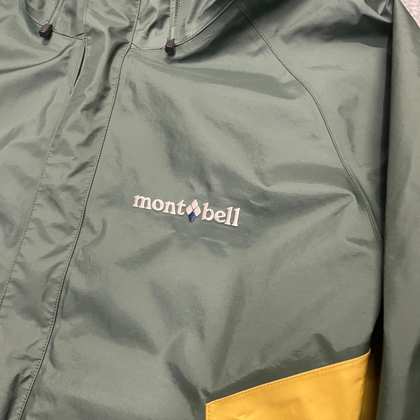 Montbell waterproof two tone green and mustard yellow jacket (L)