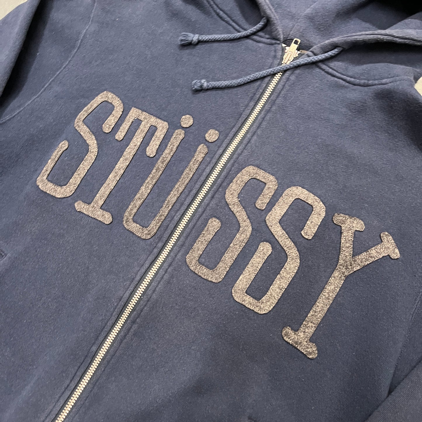 Stussy navy blue embossed spellout zipup hoodie (M)