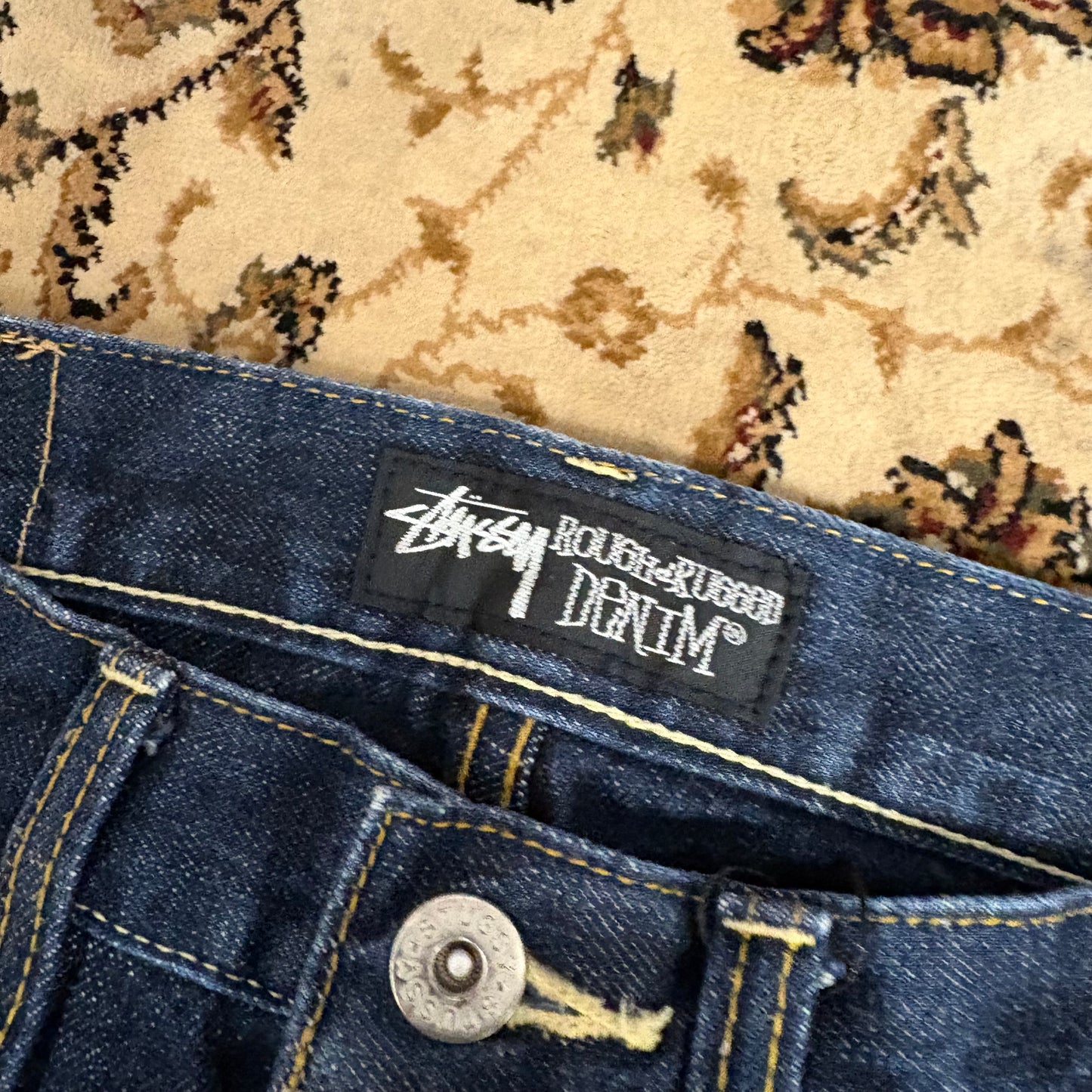 Stussy navy blue graphic jeans (W30”)