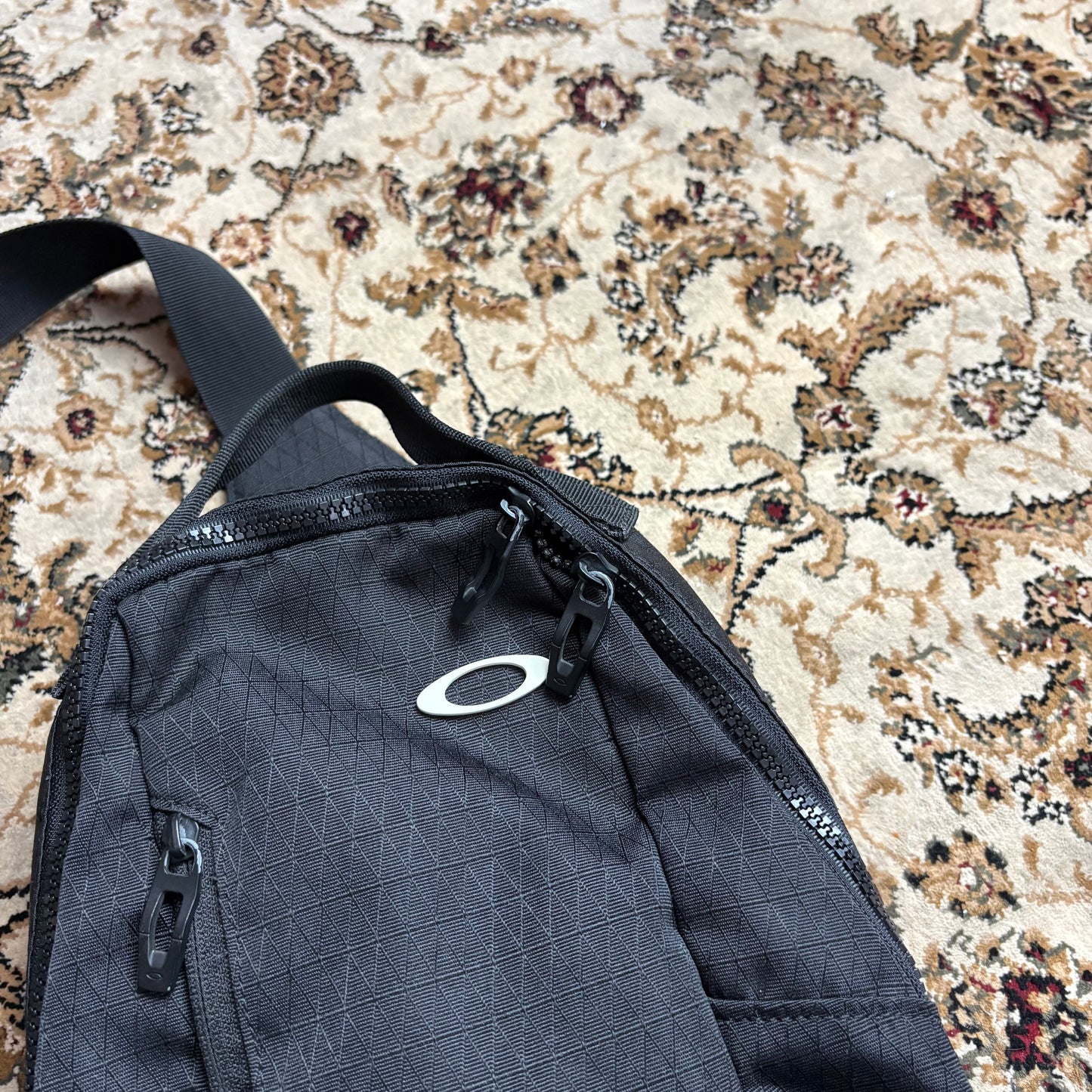 Oakley black sling bag