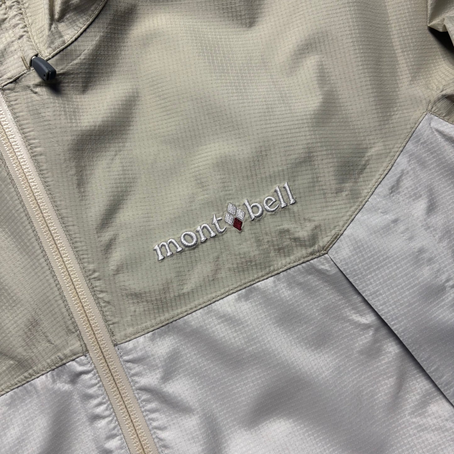 Montbell two tone beige waterproof shell jacket (L)