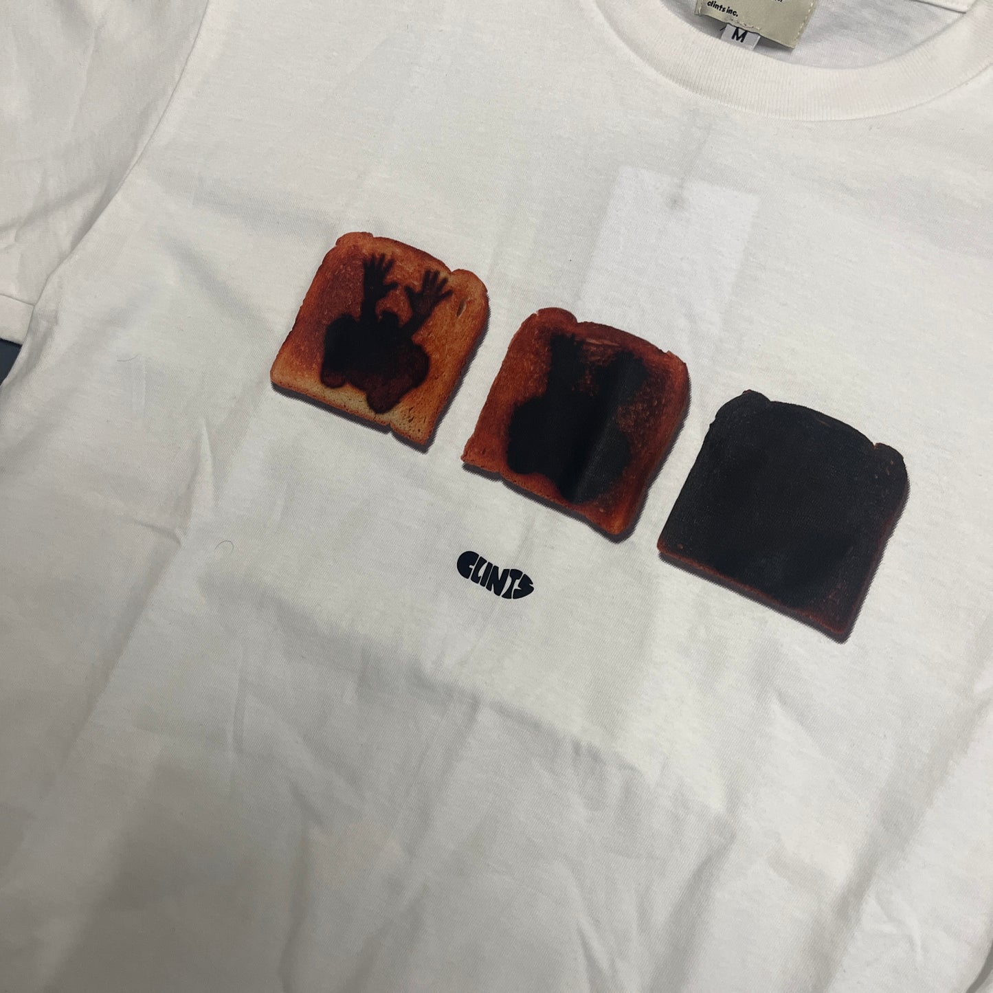 Clints inc white toast tee - never worn (M)