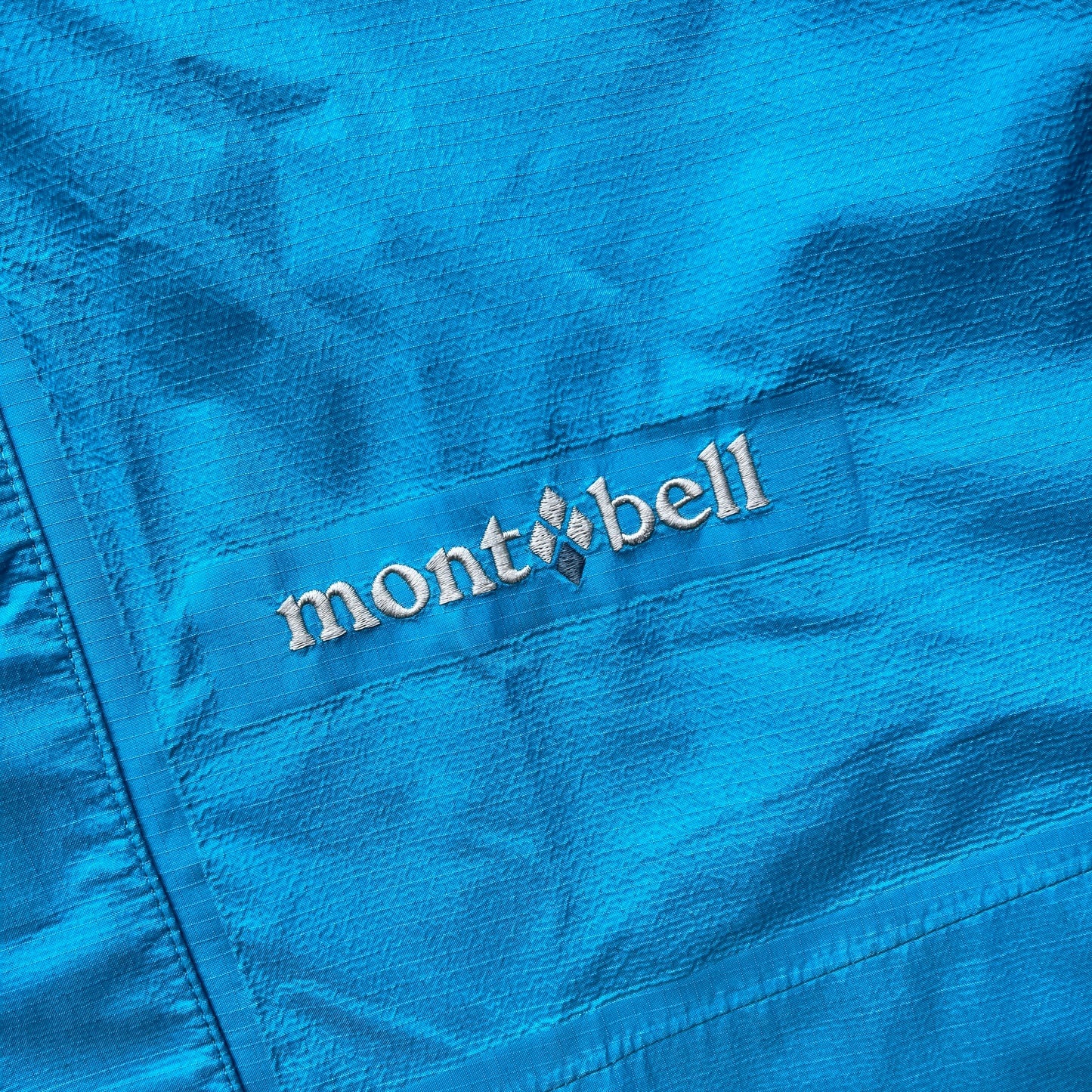 Montbell two tone blue shell jacket (with packable hood) (M)