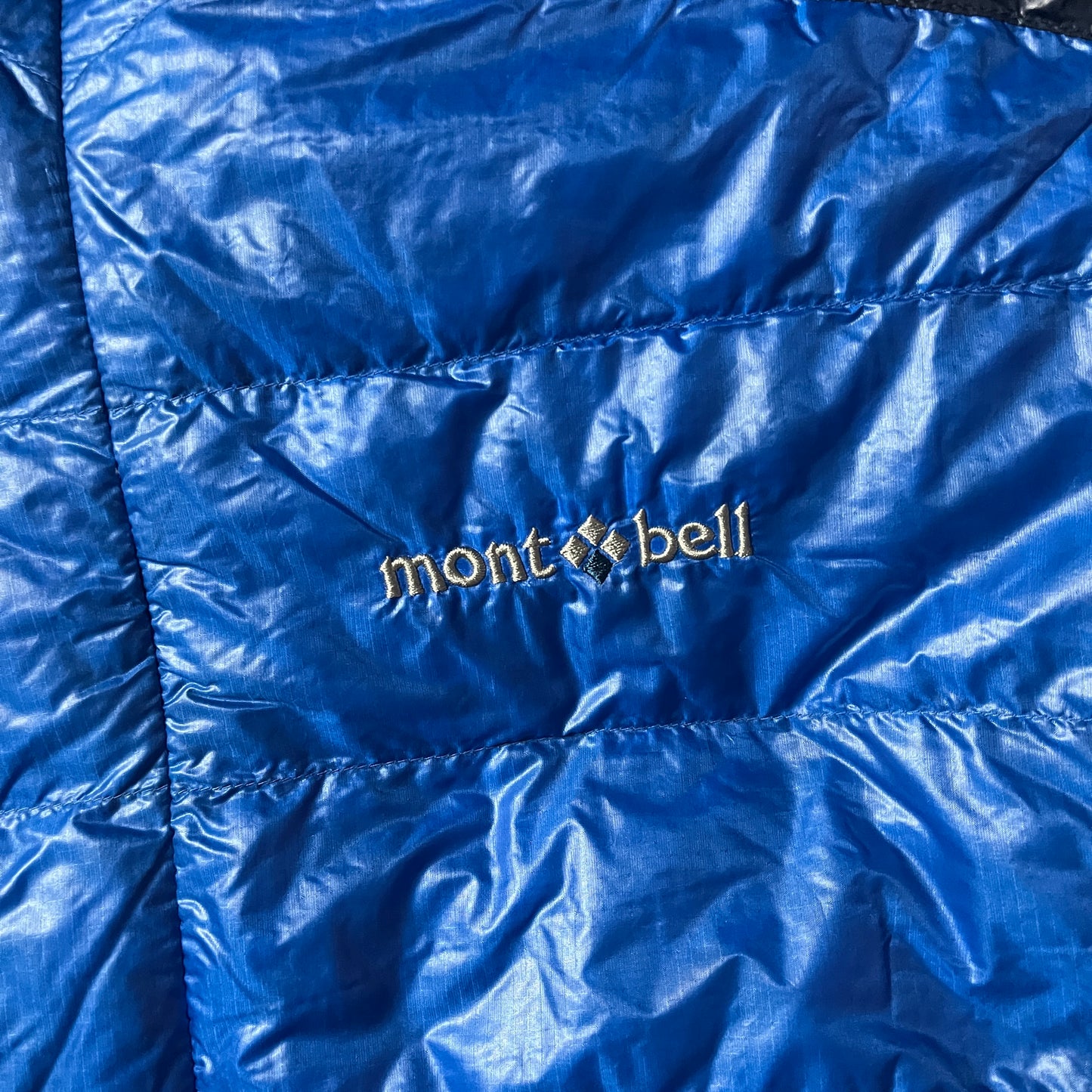 Montbell two tone blue puffer jacket (L)